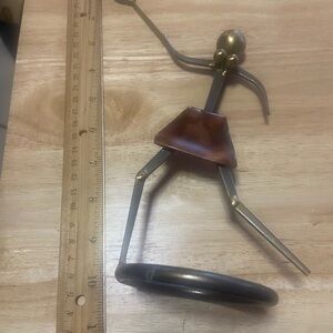 Artistic Metal Sculpture with Brown Accent